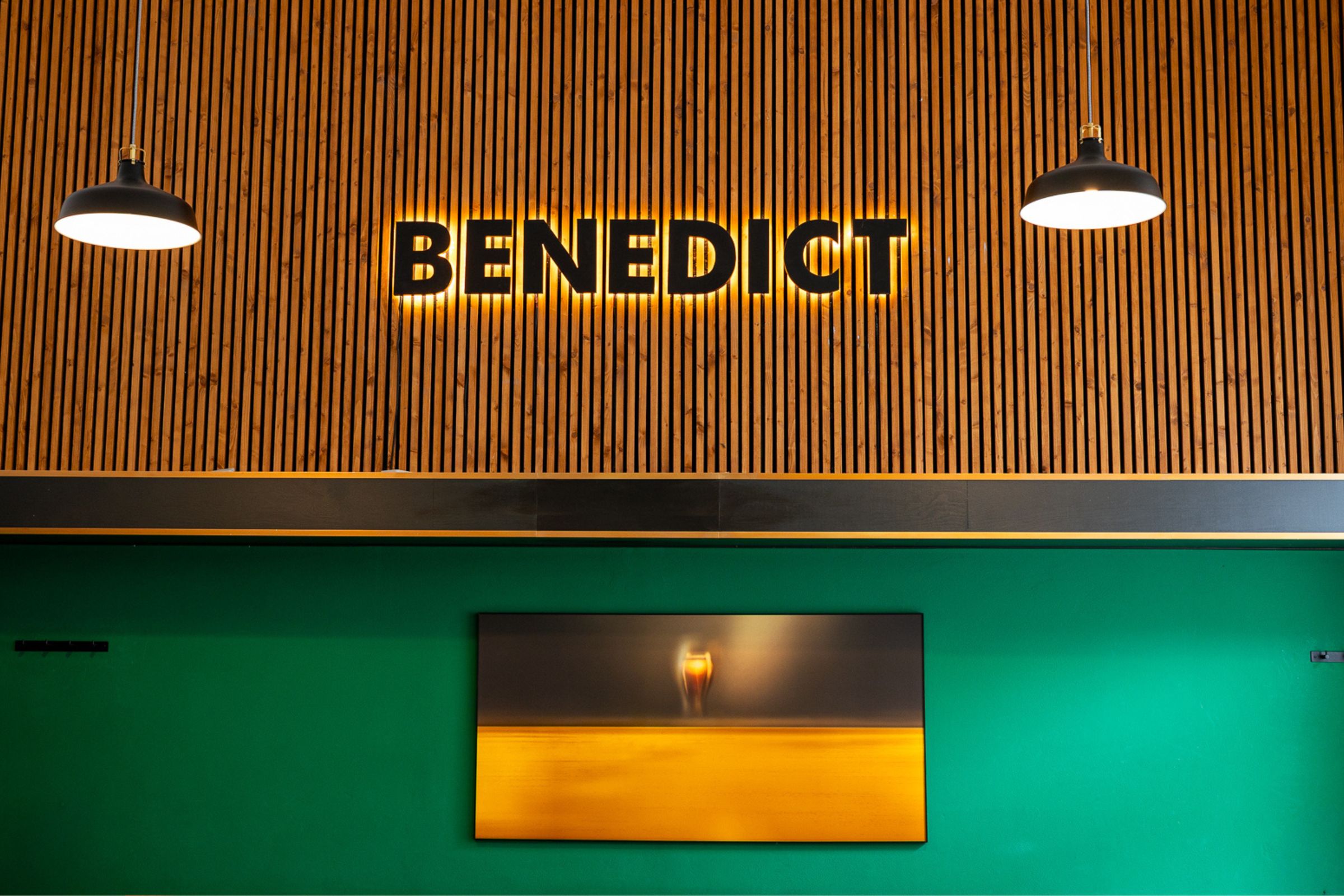 The Benedict sign over the green wall
